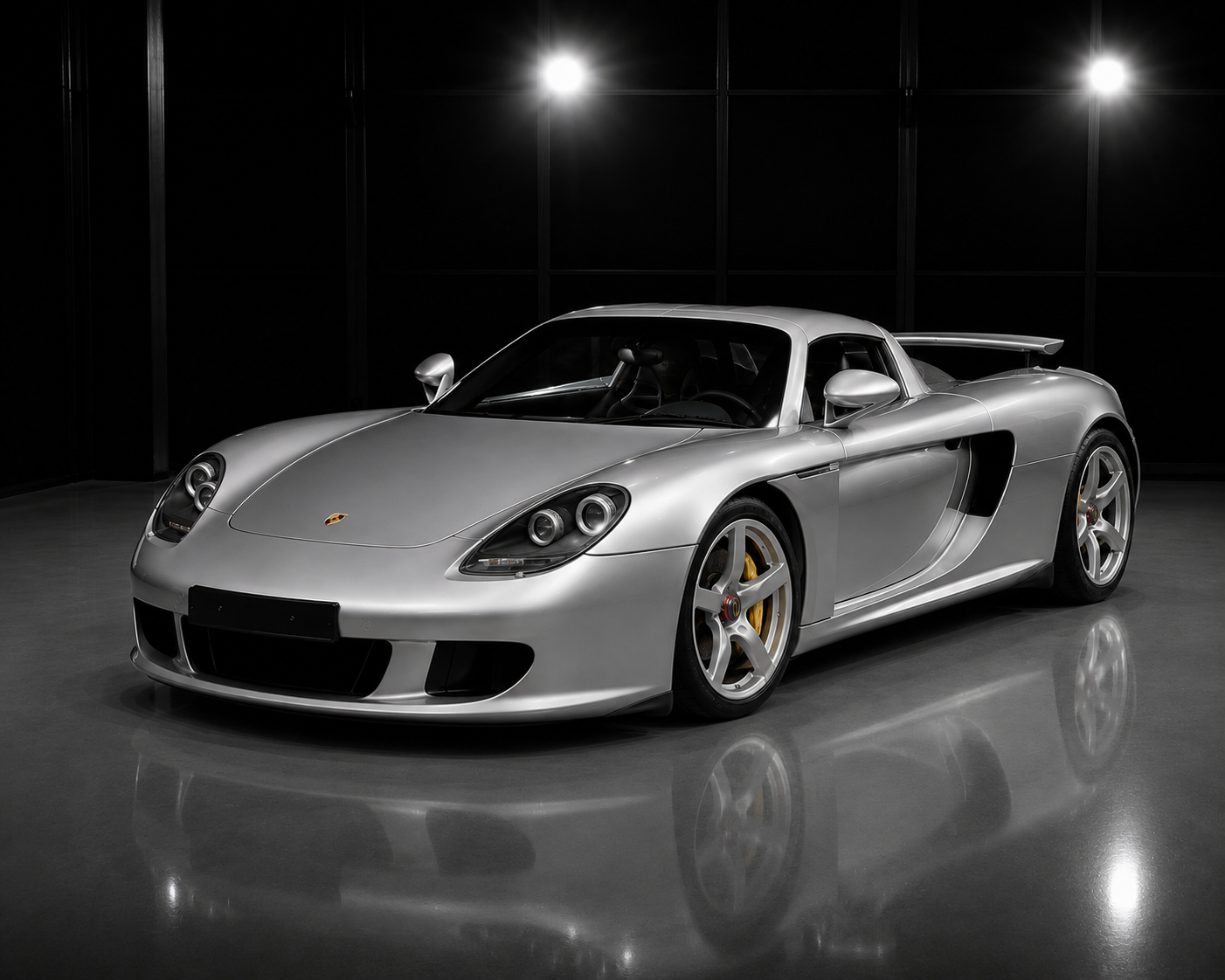 Porsche Carrera GT in a luxury automotive studio